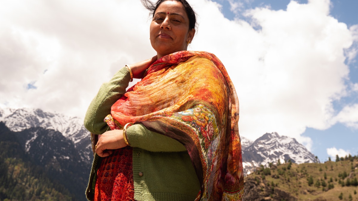 woman with mountains in background