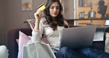 woman on laptop with credit card